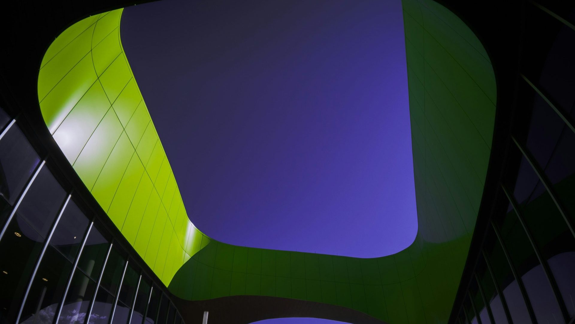 a building with a green and purple roof